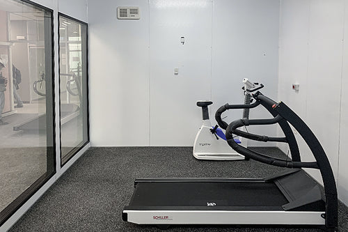Inside view of environmental chamber with workout equipment