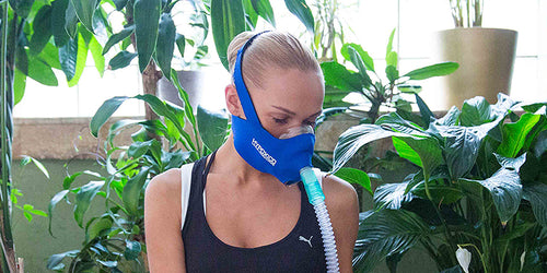 Woman wearing altitude training mask