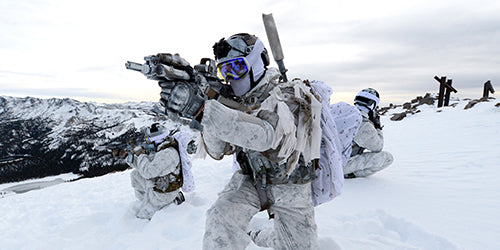 Navy SEALs training in snowy mountains